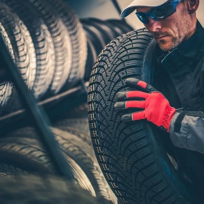 Commercial tire being mounted in the bay
